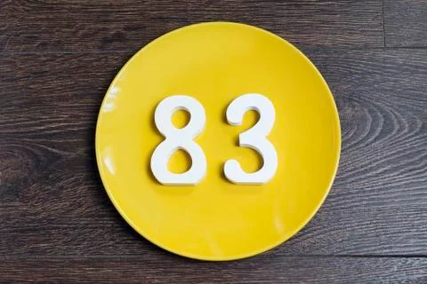 The number eighty-three on the yellow plate. Stock-Fotos