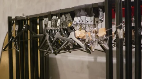 Number of empty hangers after a major sell-off in the store. Empty Hangers. Video stock 129877556