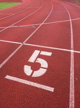 Number five. Big white track number on run rubber racetrack. Number five. ... Stock Photos