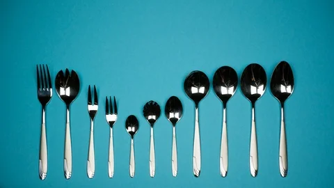 A number of forks and spoons for different dishes. Видео 88059565