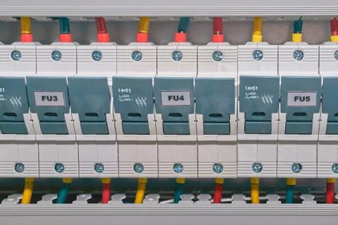 A number of fuse holders in the electrical Cabinet. Stock Photos