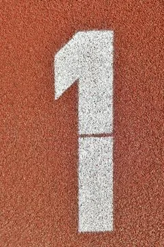 Number one on a red runway is numbered at a stadium Stock-Fotos