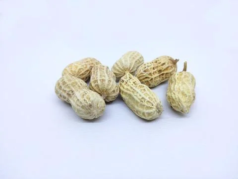 A number of peanuts on a white background Stock Photos