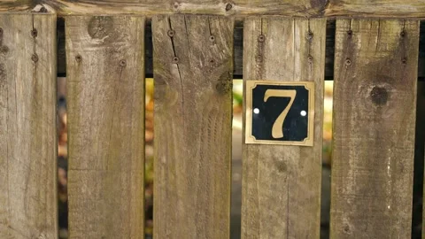 Number seven on a house gate post Stock Footage 253318224