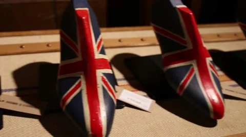 Number of several shoe lasts colored under British flag. Stock Footage 64474490