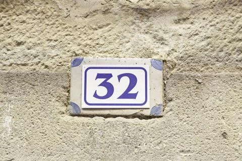 Number thirty-two on the wall Stock Photos
