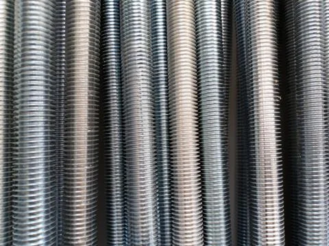A number of threaded steel rods\ Stock Photos