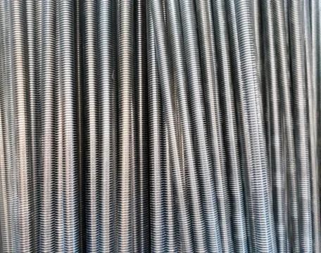A number of threaded steel rods Foto stock