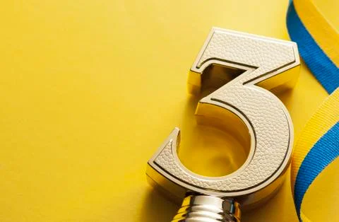 Number three 3rd place runner up gold trophy Stock Photos