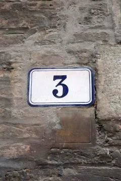 Number Three on Wall Stock Photos