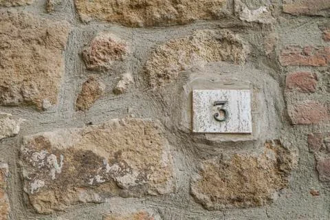 Number three on a wall Stock Photos