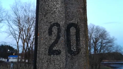 The number twenty is written in black paint on a pillar. Serial number 20. Pole Stock Footage 313664010