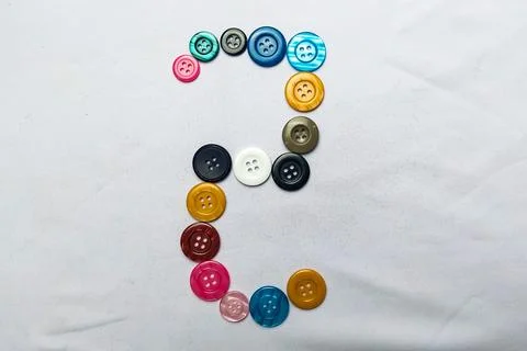 The number two is stacked from the shirt button Stock Photos