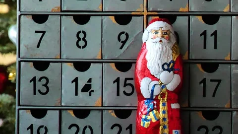 Numbered  advent calendar.Christmas background with chocolate Santa Claus Stock Footage 345265023
