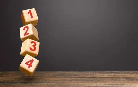 Numbered blocks on top of each other in an unstable tower. Alternate items .. Stock Photos