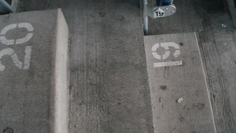 Numbered concrete stadium steps on stairs Stock Footage 97729243