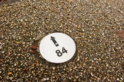 Numbered direction sign in pavement Stock Photos
