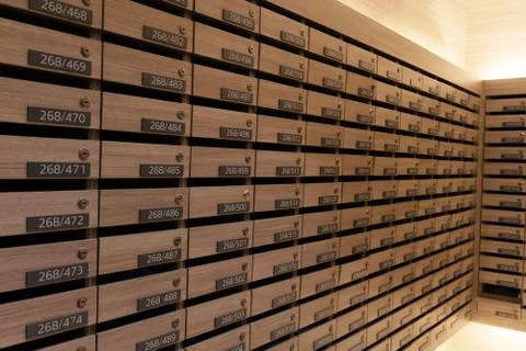 Numbered mailboxes and lockers in raw in the condo Stock Photos