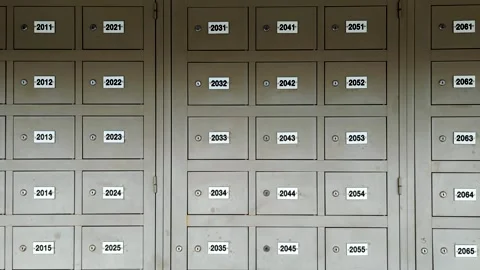 Numbered secure locker unit with key locks for mail parcel and letter deliveries Stock Footage 311844093