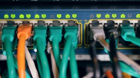 Numbered slots with multiple cables plugged into them 動画素材 112177674