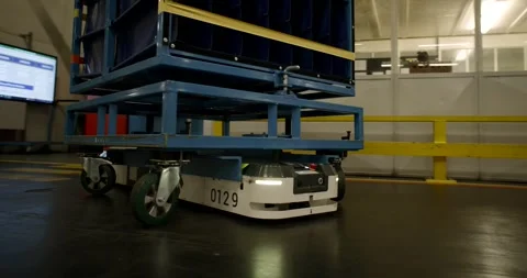 Numbered Transport Robot Passing Worker in Factory Aisle, Side Tracking Shot Stock Footage 340300785