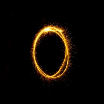 Numbers 0 to 9 created using a sparkler on black Stock Photos