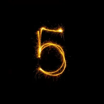 Numbers 0 to 9 created using a sparkler on black Stock Photos