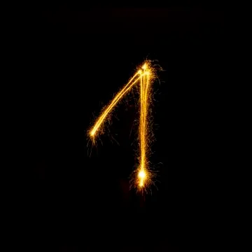 Numbers 0 to 9 created using a sparkler on black Foto stock