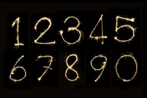 Numbers 0 - 9 Sparkler firework light isolated on black background Foto stock