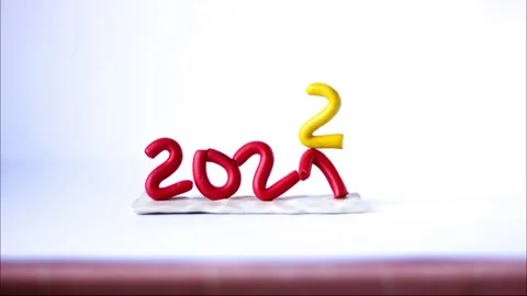 Numbers 2021 from red plasticine stand on a white background, the number 2 arriv Stock Footage 163100981