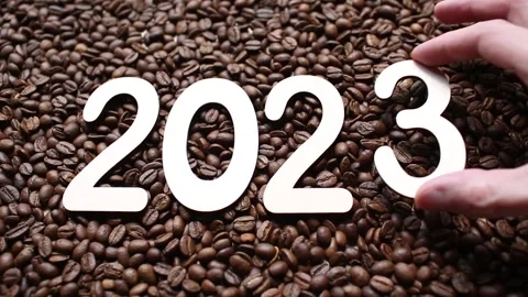 Numbers 2023 on the background of roasted coffee beans. New Year. Top view. Man Stock Footage 194306468
