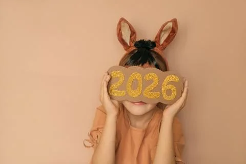 The numbers 2026 hide the face of a faceless girl. Greetings, greetings and N Stock Photos