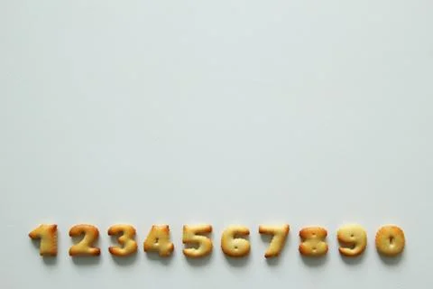 The numbers from the cookies on the white background. Stock Photos