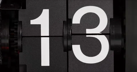 The numbers on the flip clock changed from thirteen to fourteen. Stock Footage 183710372
