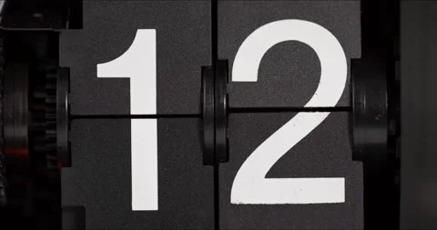 The numbers on the flip clock changed from twelve to thirteen. Stock Footage 183710177