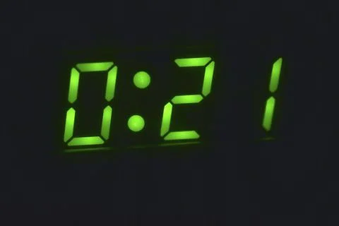 Numbers on the LED clock in the dark Foto stock