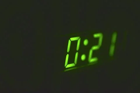 Numbers on the LED clock in the dark Foto stock