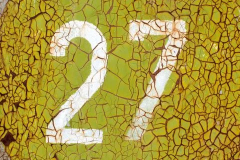 Numbers on the old rusty metal wall Stock Photos
