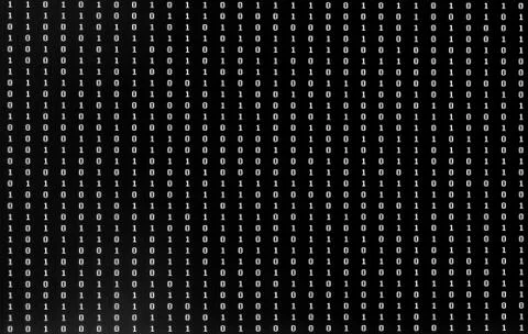 Numbers One and Zero of binary code  on the pc monitor 写真素材