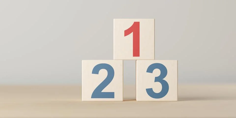 Numbers one, two and three on wooden blocks in podium arrangement on table,.. Illustrazione stock