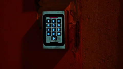 Numeric keypad with blue illuminated number buttons. Red flashing bar. Code lock Video stock 220745241