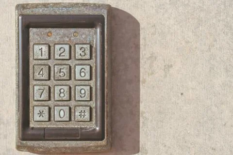 Numeric Keypad on concrete wall Foto stock