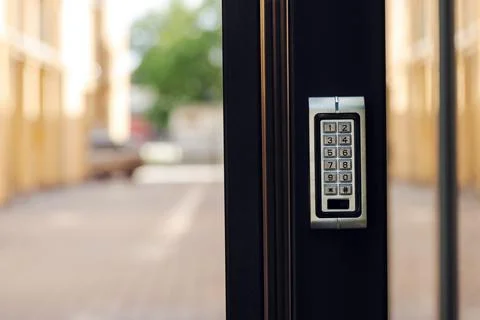 Numeric keypad door lock at building entrance Stock Photos