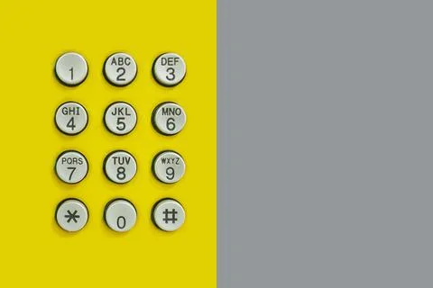 Numeric keypad of phone on the yellow background and have Gray Paper on the s 스톡 사진
