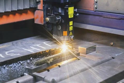 Numerical control machine cuts metal sheet with laser Stock Photos
