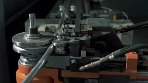 Numerically controlled machine bends metal Stockbeeldmateriaal 192608807