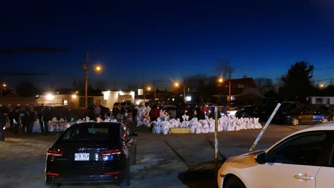 Numerous civilian helping to do some sand bags Stock Footage 114705648