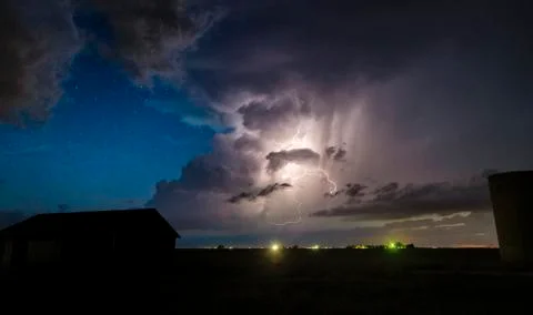 Numerous cloud-to-cloud lightning strikes seen along the dryline at night, with Stock Photos