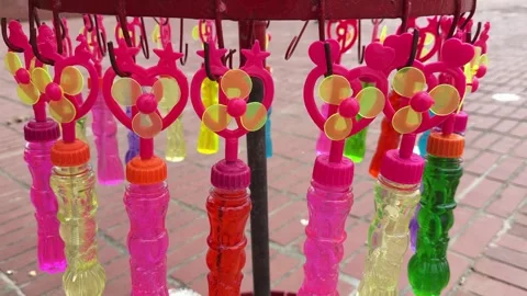 Numerous colorful bubble wands featuring heart and star shapes. video Video stock 310733766