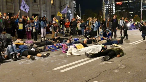 Numerous demonstrators sleeping in the street Stock Footage 120038224